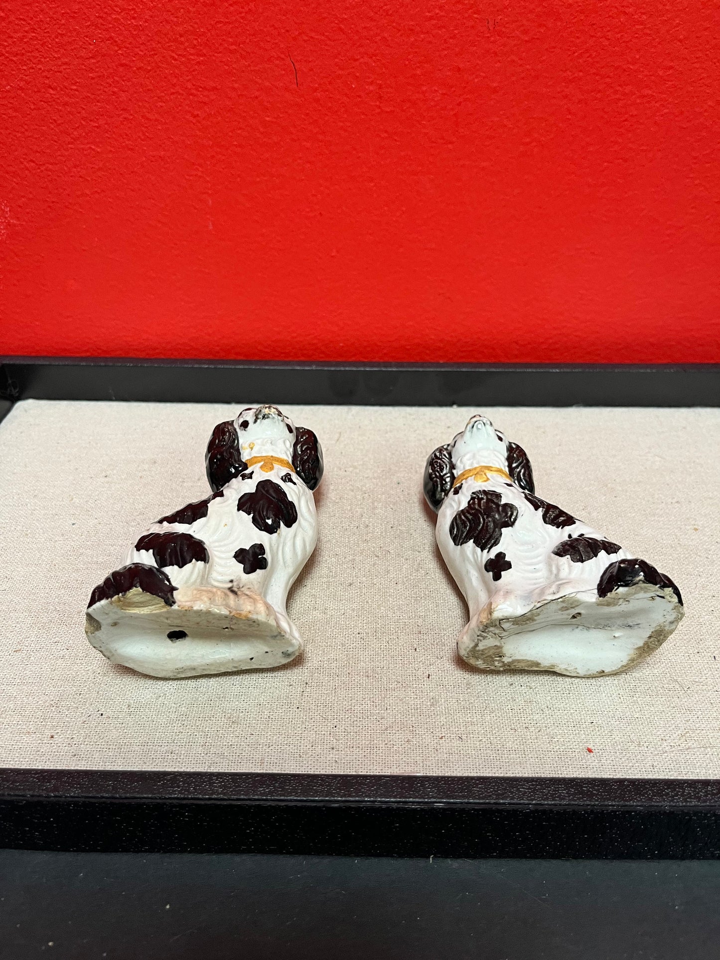 Lovely pair of 19 century Staffordshire spaniels  4 inches high, and in less than perfect condition