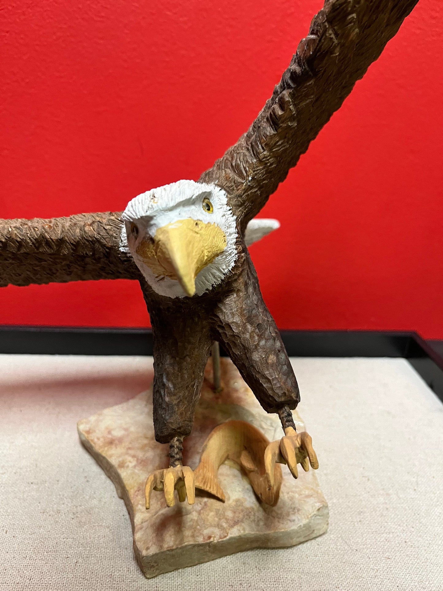 A  Lovely hand carved 11 x 11“ eagle on rock stand with salmon prey