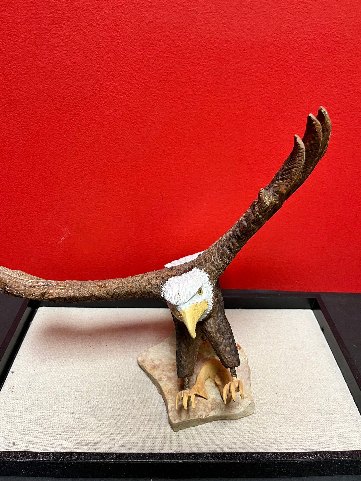 A  Lovely hand carved 11 x 11“ eagle on rock stand with salmon prey