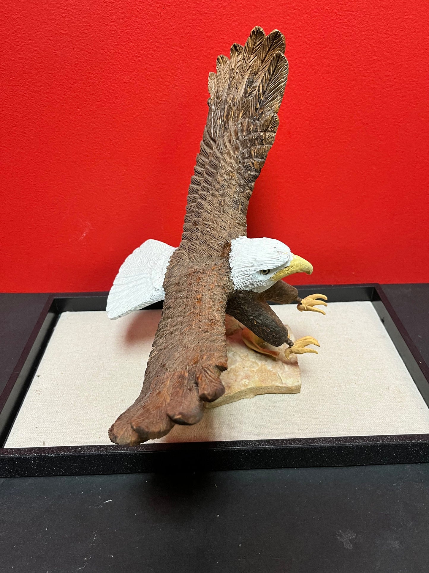 A  Lovely hand carved 11 x 11“ eagle on rock stand with salmon prey