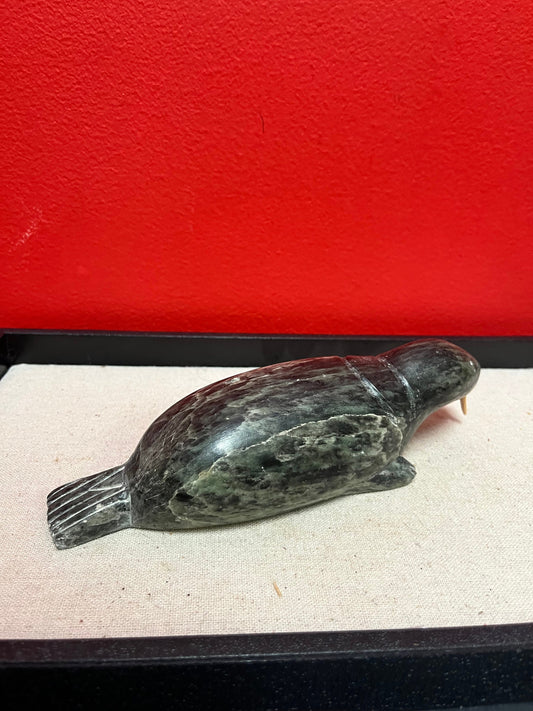 A  Fabulous 8 inch long indigenous Inuit soapstone walrus signed by well-known artist