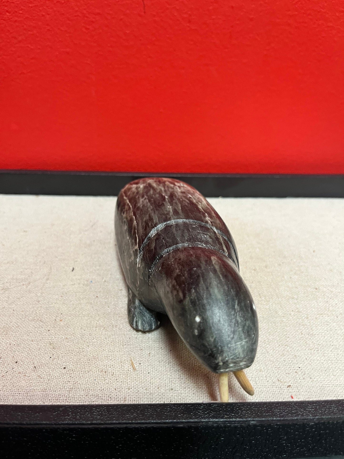 A  Fabulous 8 inch long indigenous Inuit soapstone walrus signed by well-known artist