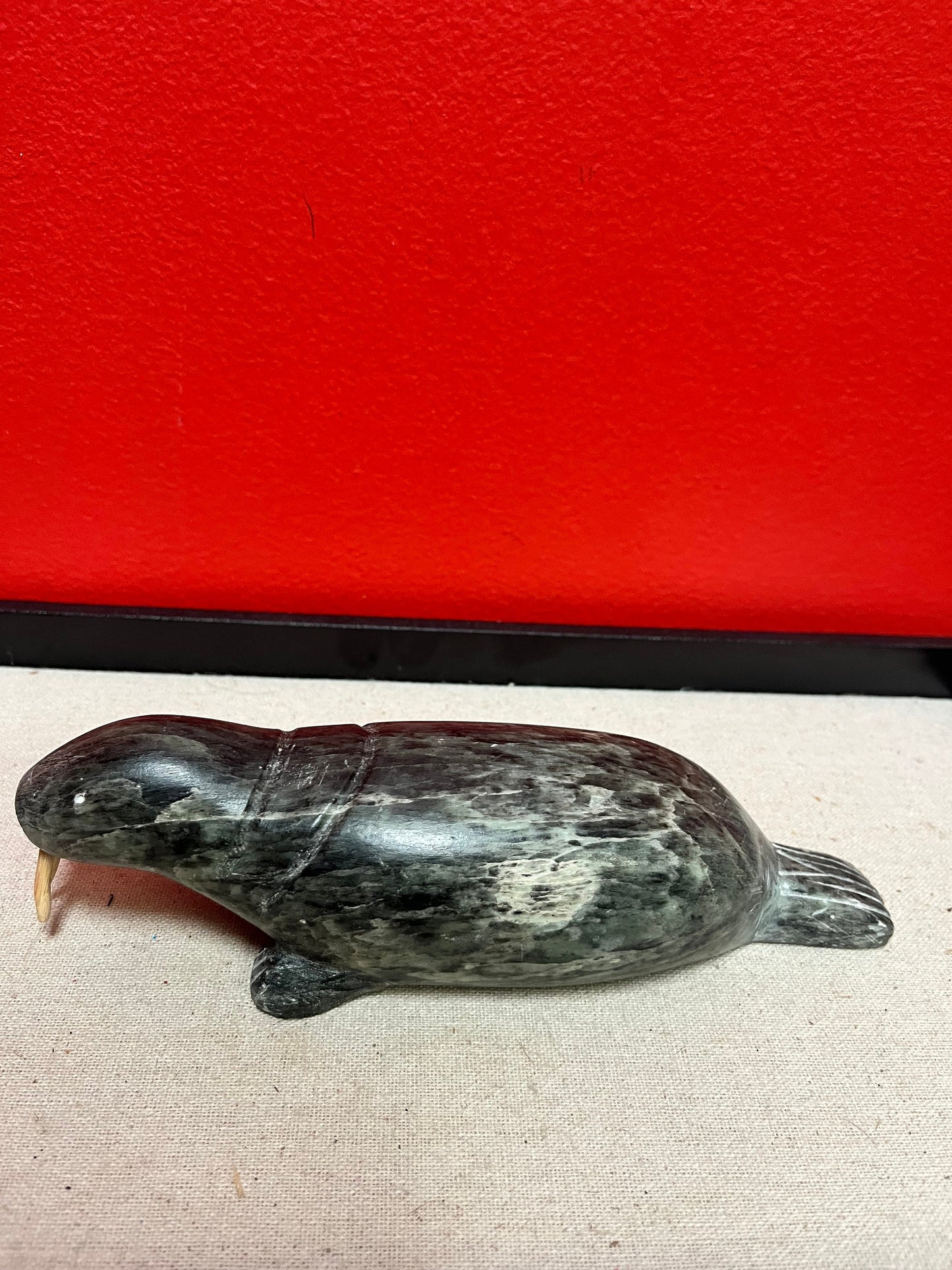 A  Fabulous 8 inch long indigenous Inuit soapstone walrus signed by well-known artist
