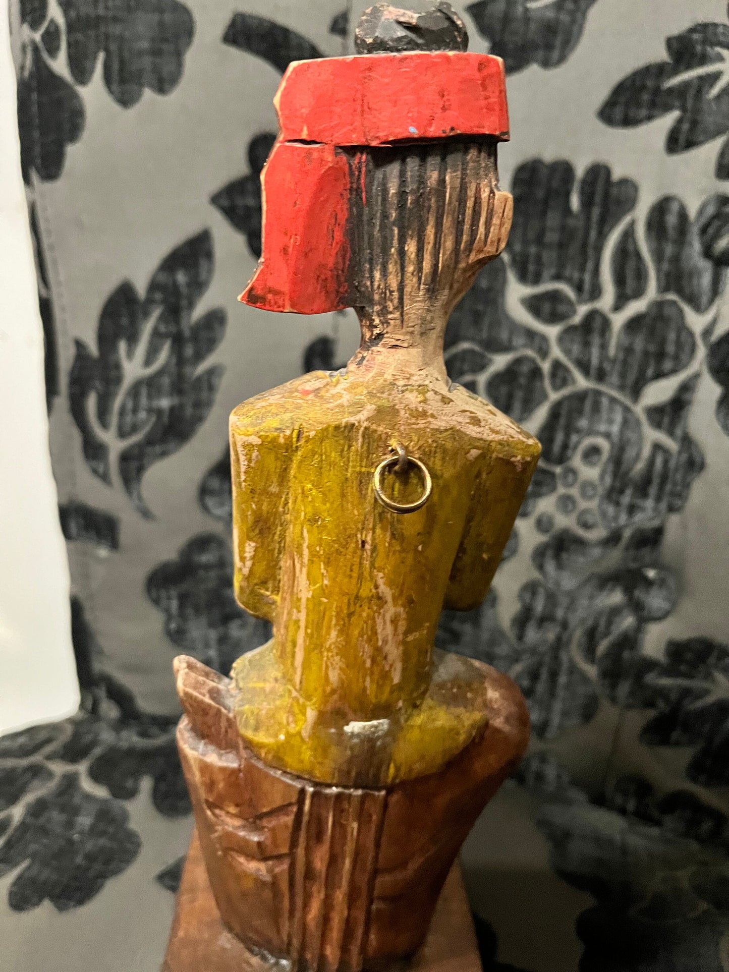 A 11 inch south east wooden statue  stand or hang