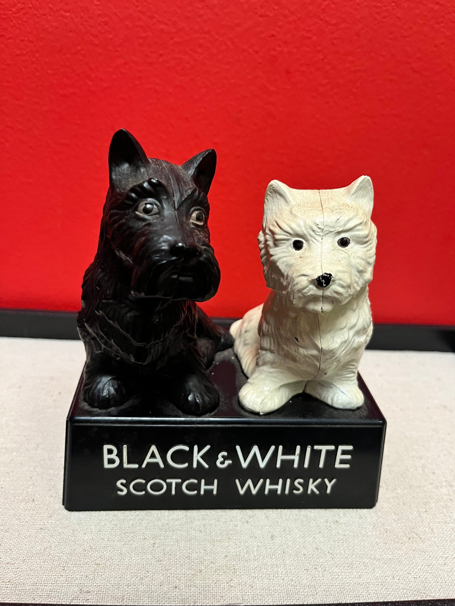 A  Lovely 6 inch tall, black and white Buchanan scotch whiskey Scotty dog plastic store advertising figure