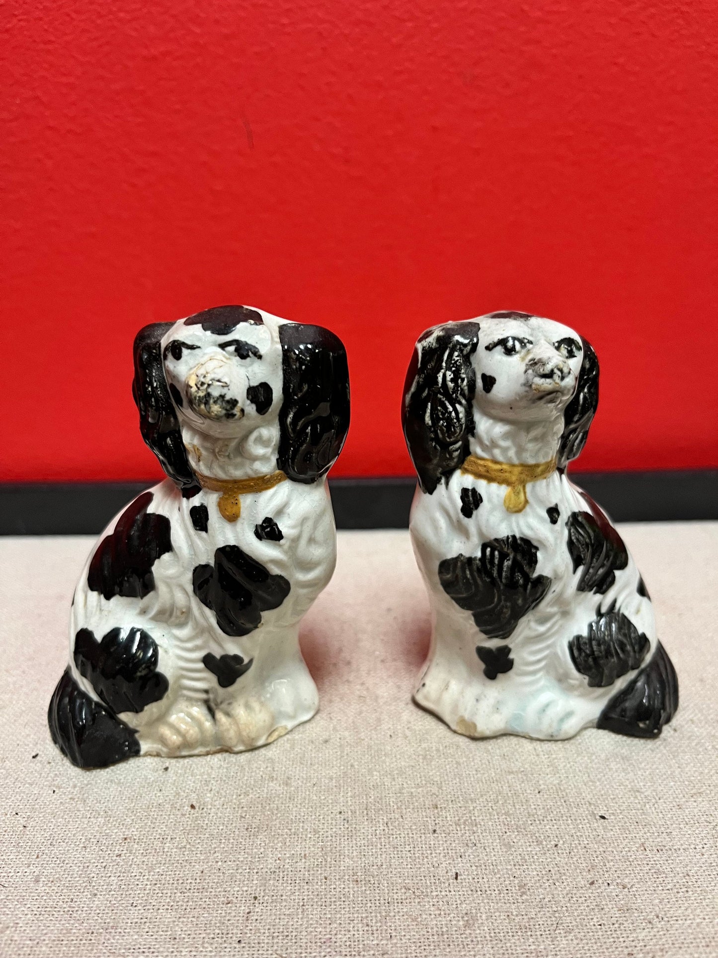 Lovely pair of 19 century Staffordshire spaniels  4 inches high, and in less than perfect condition