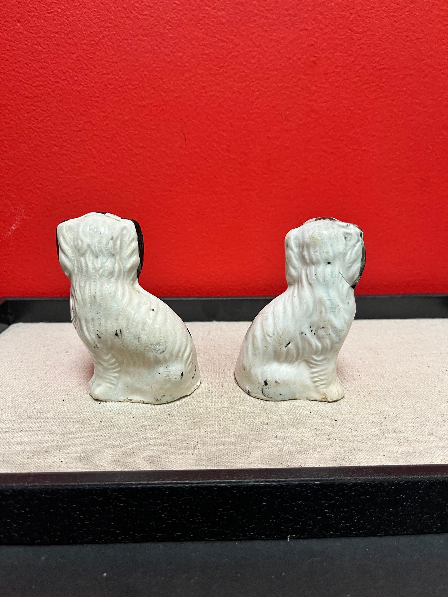 Lovely pair of 19 century Staffordshire spaniels  4 inches high, and in less than perfect condition