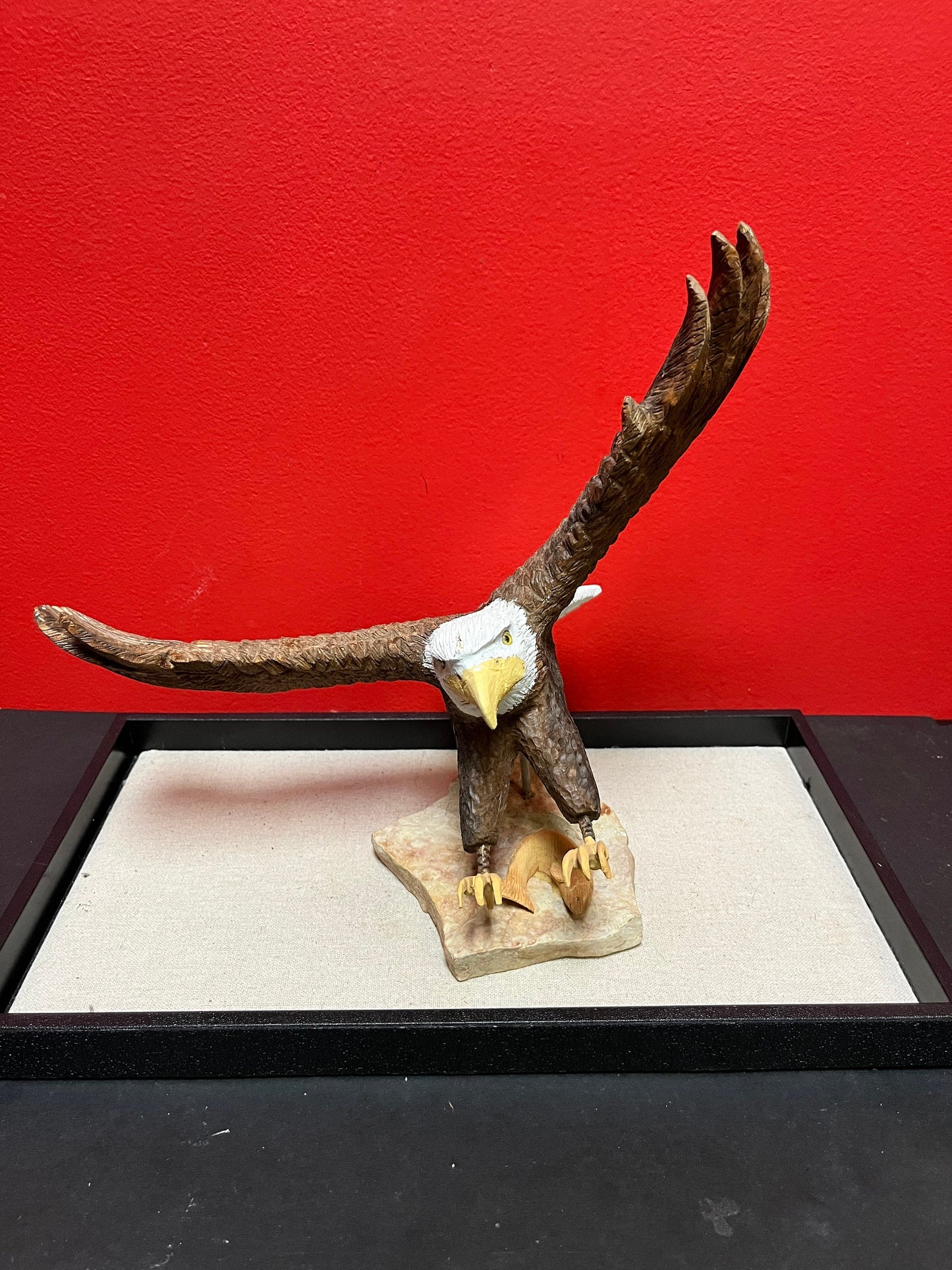 A  Lovely hand carved 11 x 11“ eagle on rock stand with salmon prey