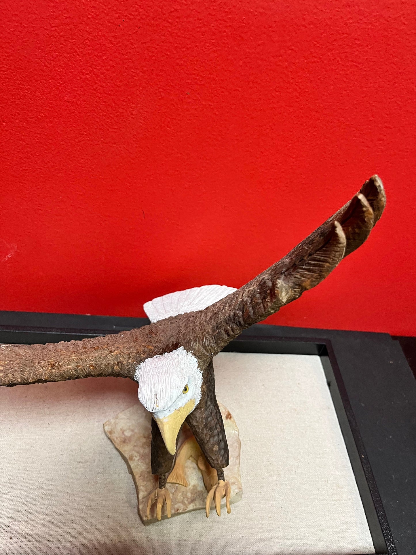 A  Lovely hand carved 11 x 11“ eagle on rock stand with salmon prey