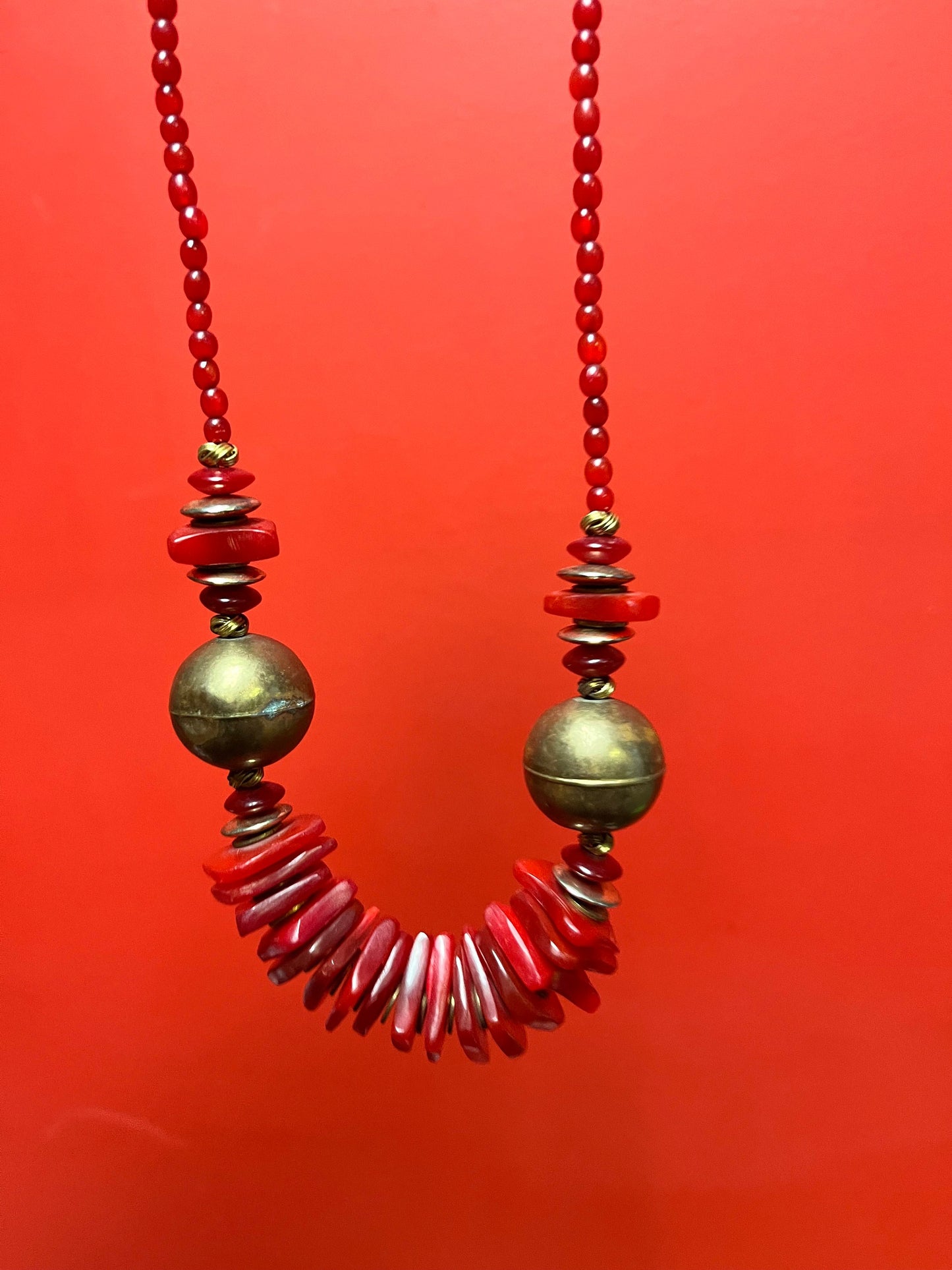 Approximately 22 inch long lucite  and brass necklace  great colour and look