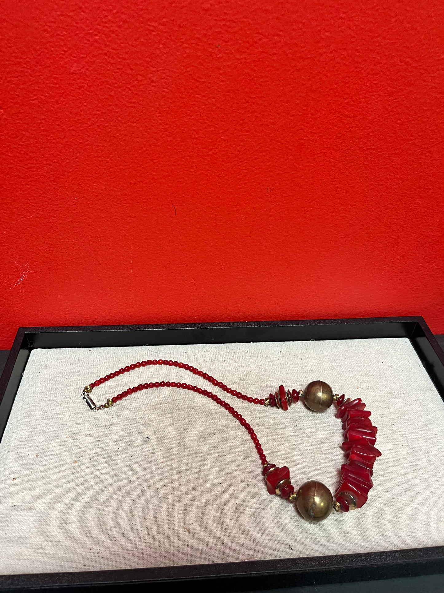 Approximately 22 inch long lucite  and brass necklace  great colour and look