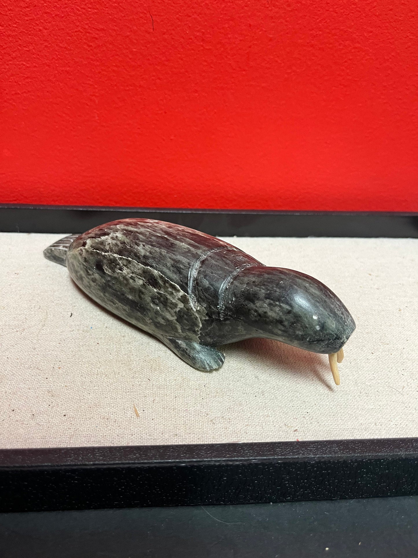 A  Fabulous 8 inch long indigenous Inuit soapstone walrus signed by well-known artist