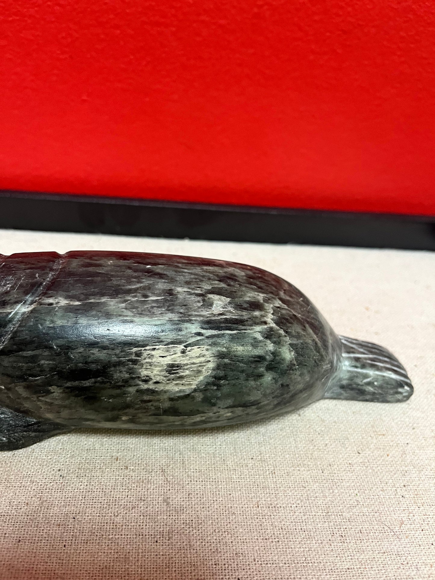 A  Fabulous 8 inch long indigenous Inuit soapstone walrus signed by well-known artist