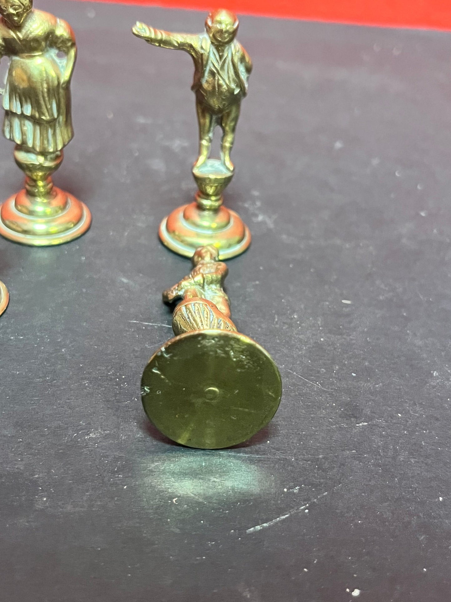 Lovely antique set of four brass Dickens character pipe  tampers  wonderful set in great condition and 2. 5 inches high each.