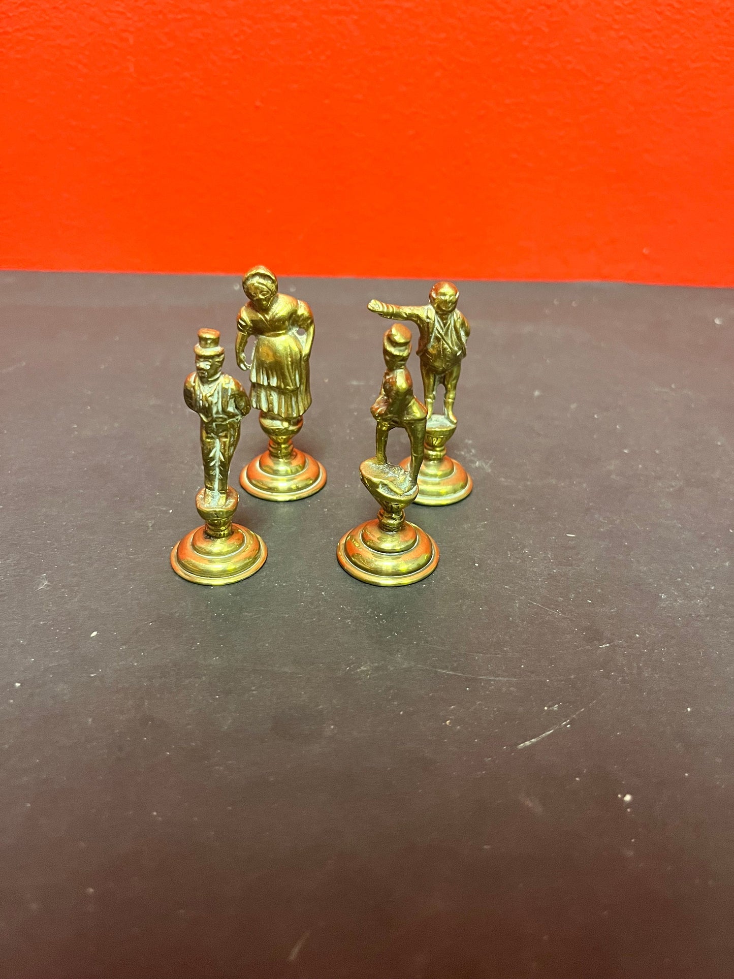 Lovely antique set of four brass Dickens character pipe  tampers  wonderful set in great condition and 2. 5 inches high each.