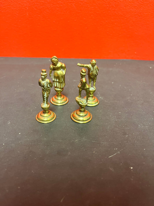 Lovely antique set of four brass Dickens character pipe  tampers  wonderful set in great condition and 2. 5 inches high each.
