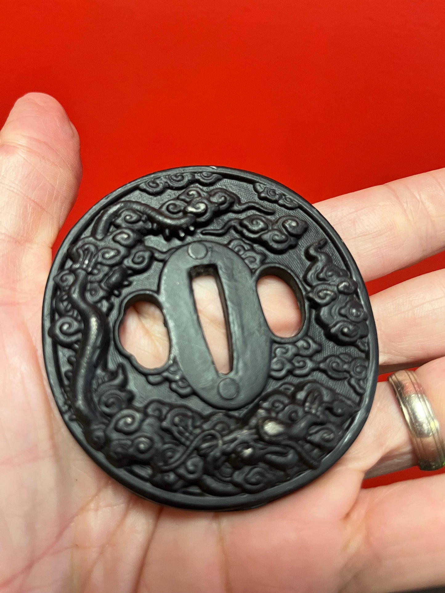 Lovely antique Japanese bronze and GILT tsuba set in stone - stone isnt perfect see photos  2.5 inches  great value - perfect paperweight