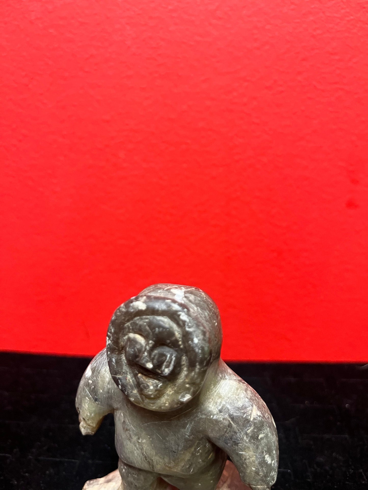 A lovely, 4.5 inch tall, antique indigenous Inuit soapstone statue of a hunter  some minor scratches - signed beauty