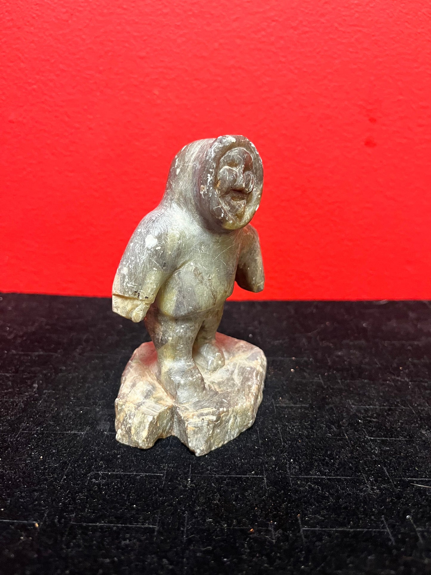 A lovely, 4.5 inch tall, antique indigenous Inuit soapstone statue of a hunter  some minor scratches - signed beauty