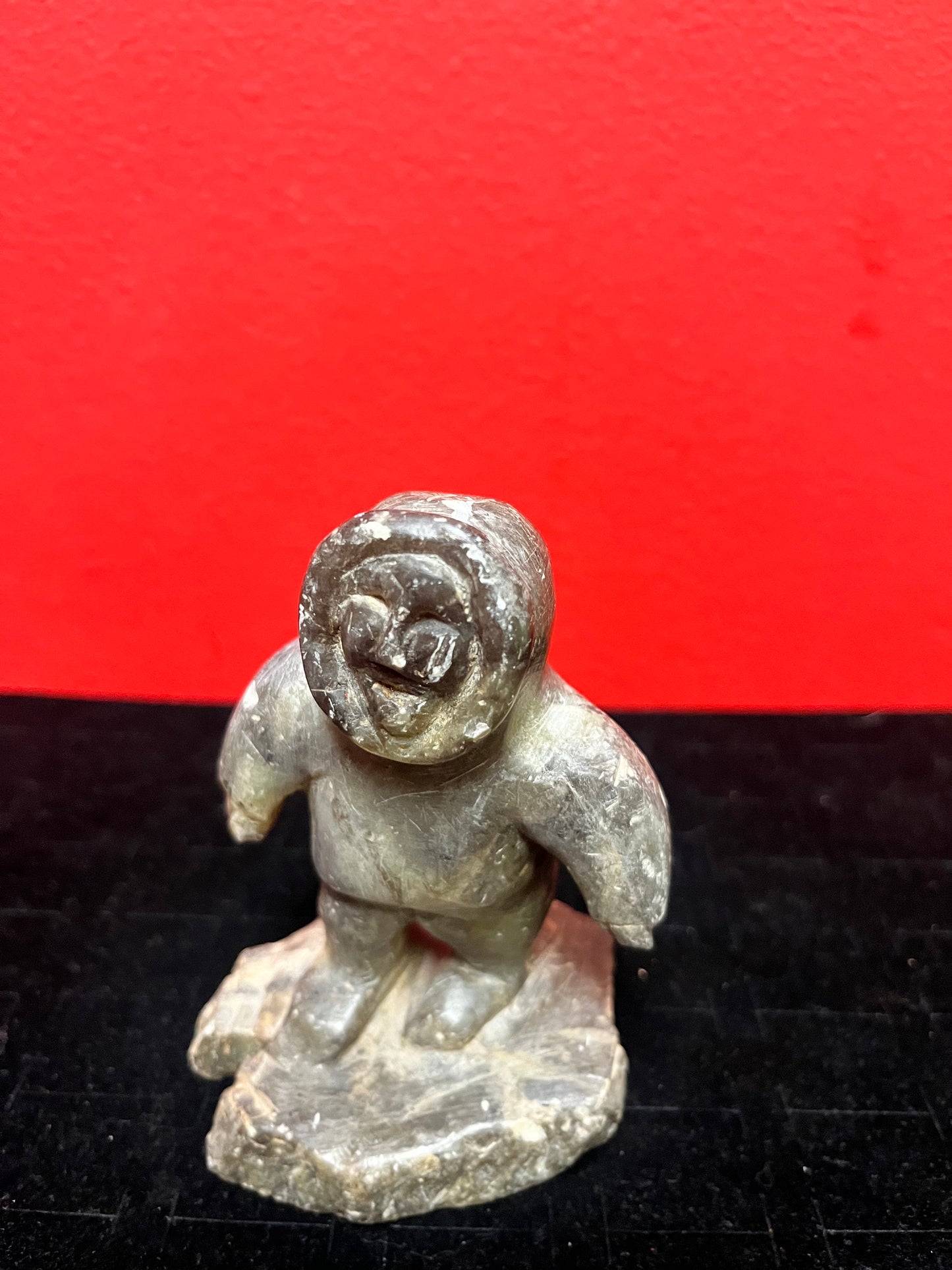 A lovely, 4.5 inch tall, antique indigenous Inuit soapstone statue of a hunter  some minor scratches - signed beauty