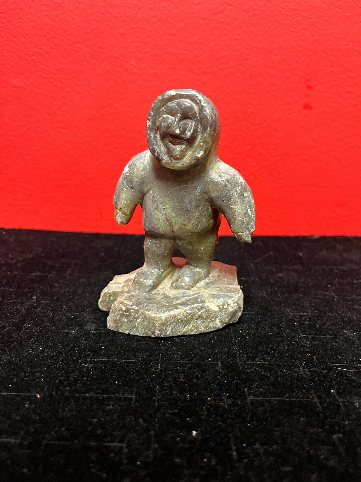 A lovely, 4.5 inch tall, antique indigenous Inuit soapstone statue of a hunter  some minor scratches - signed beauty