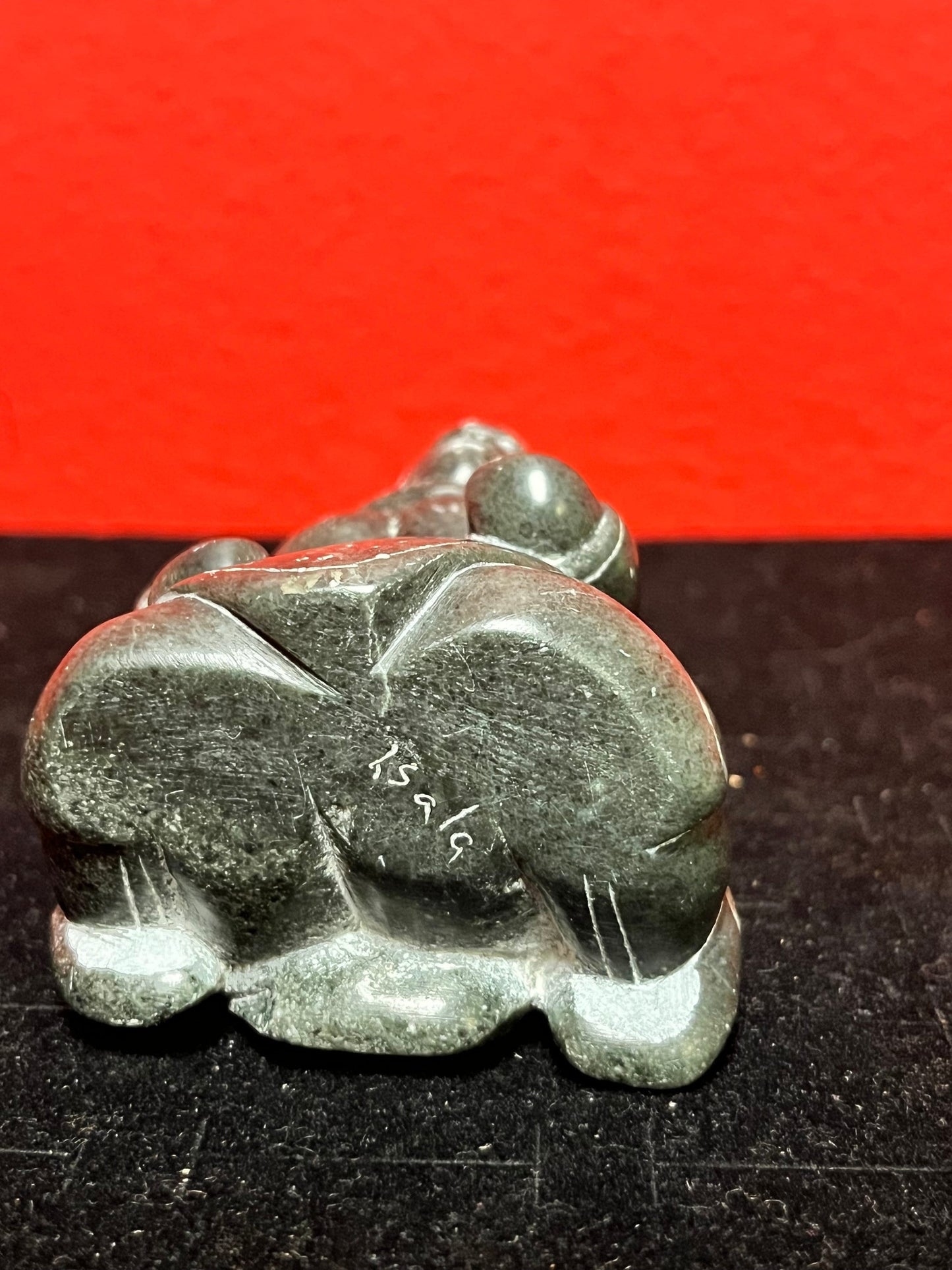 Exquisite museum quality  signed 3 inch tall antique, female artist indigenous  Inuit statue of a woman  intense quality and detail