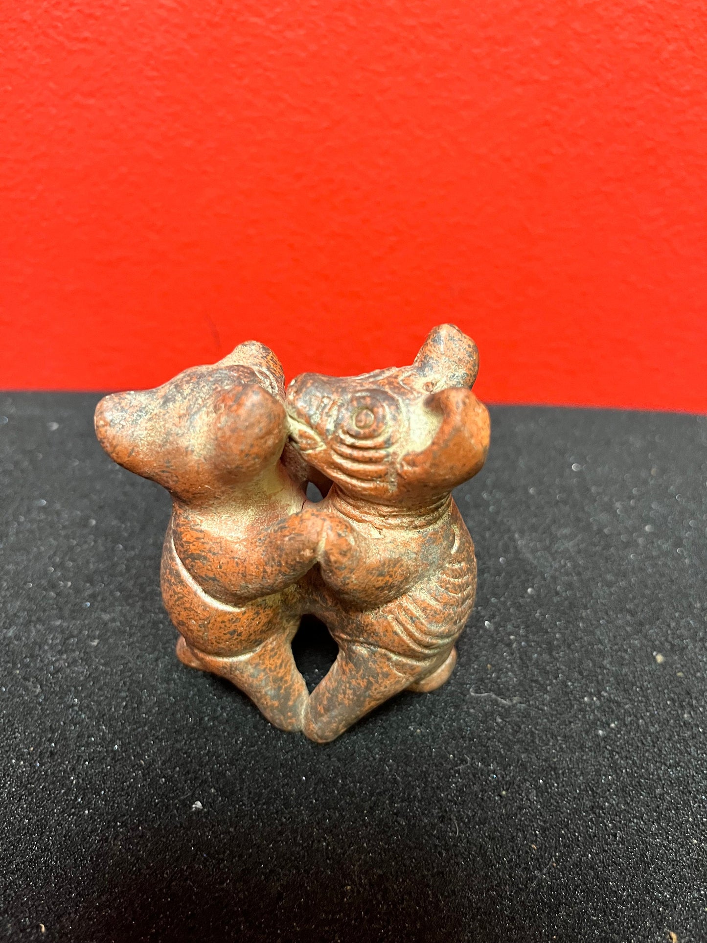3 inch high vintage Colombian Clay statue of pigs kissing  whimsical statue in perfect condition