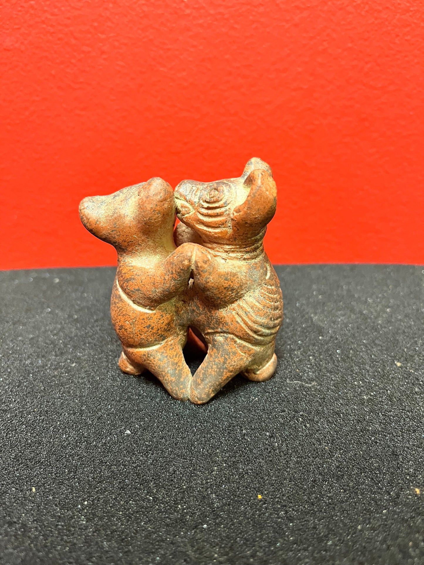 3 inch high vintage Colombian Clay statue of pigs kissing  whimsical statue in perfect condition