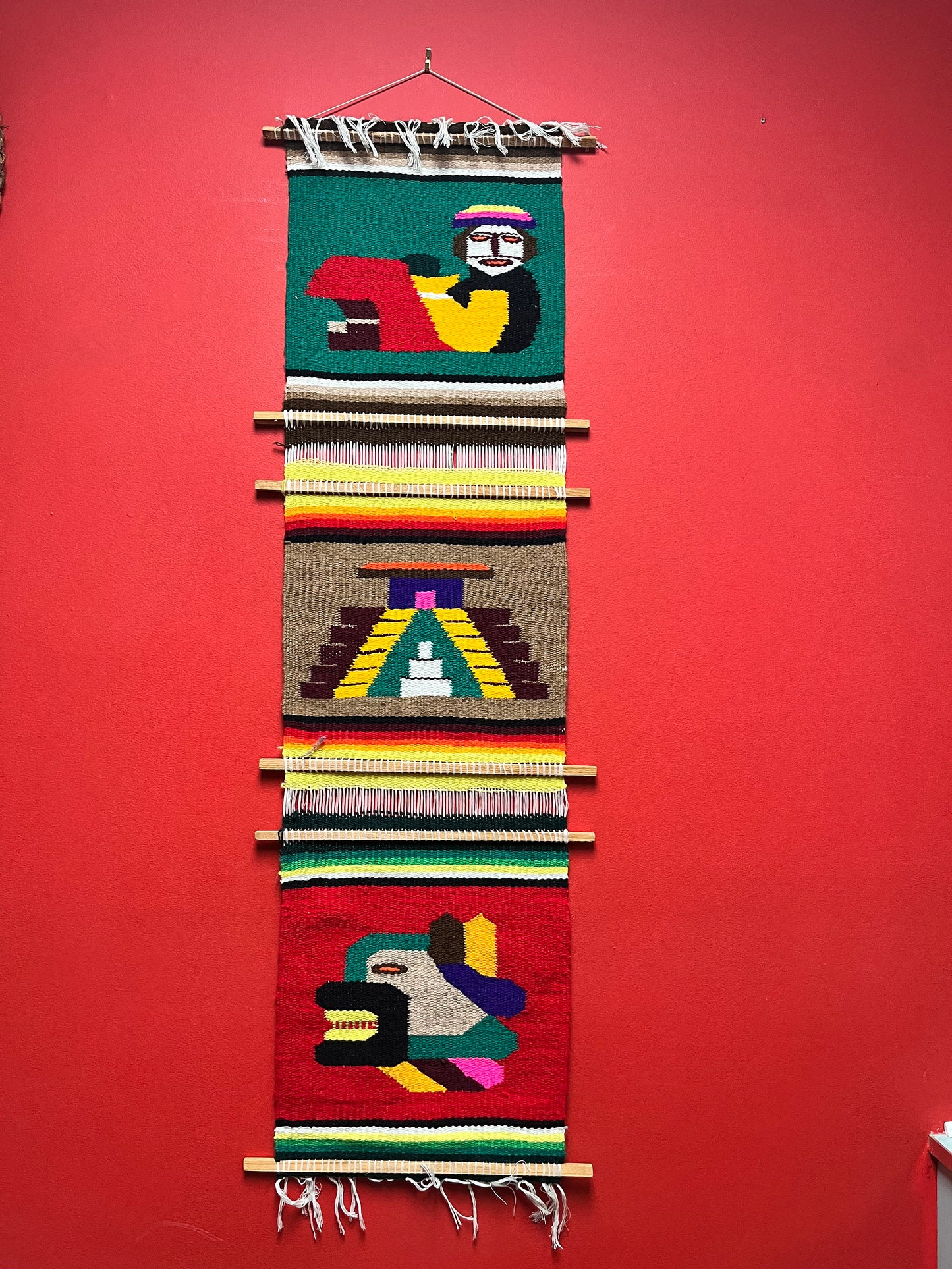 A  vintage wool  South American Aztec imagery - approximate 48 x 14  - wool handmade wall hanging   wow