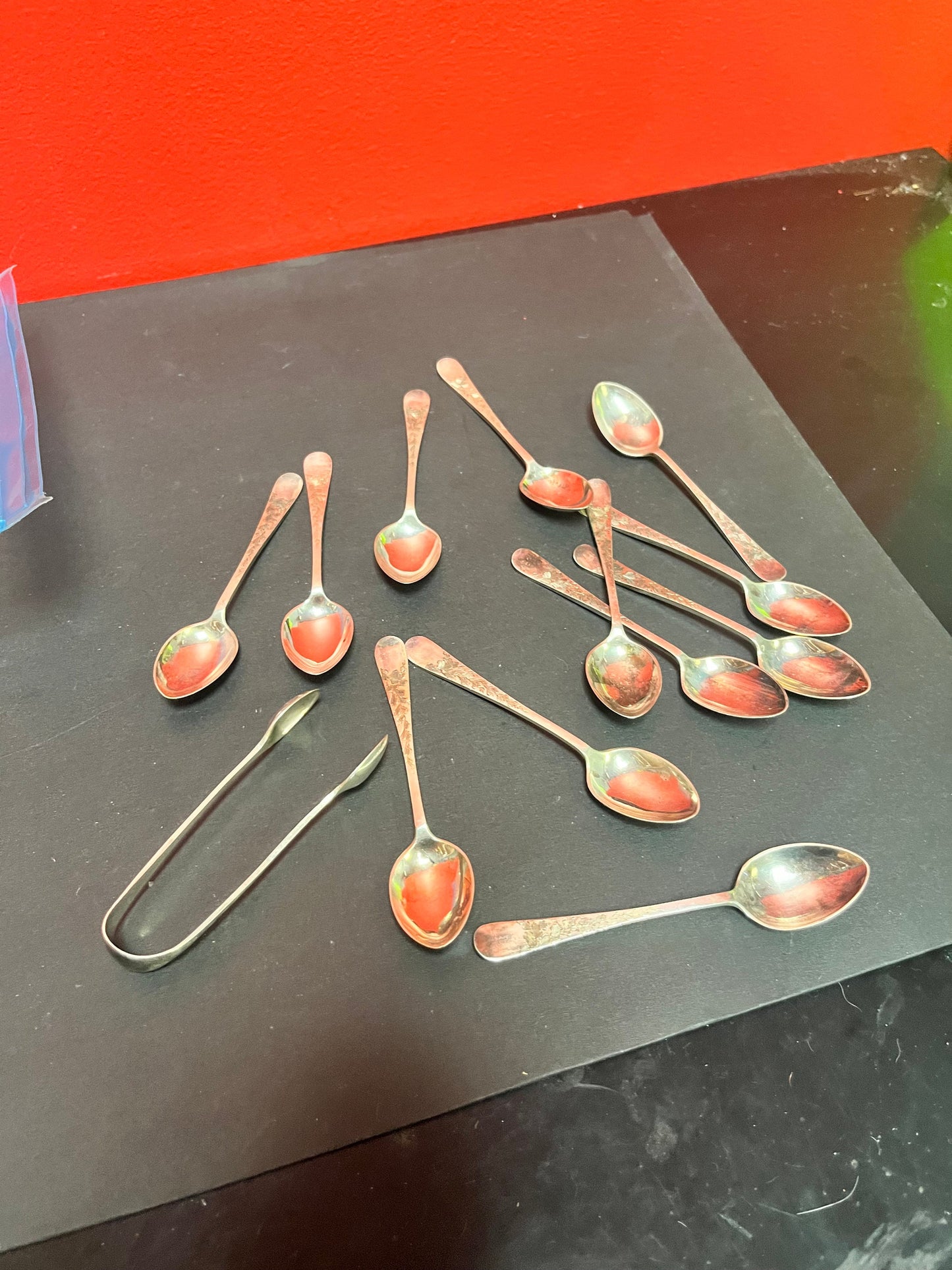 Set of 12 English sterling silver hallmarked teaspoons and sugar tongs  pretty design and needs a quick polish  great value