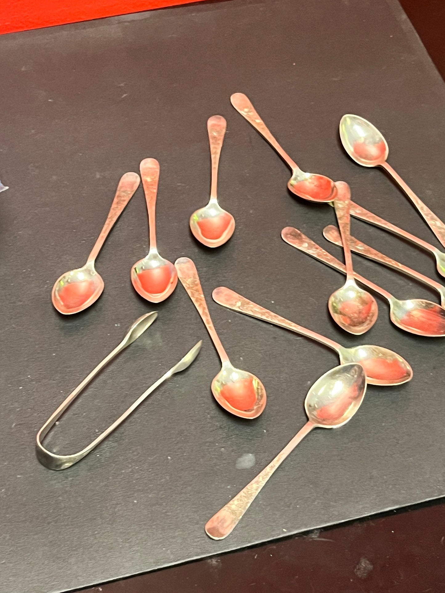 Set of 12 English sterling silver hallmarked teaspoons and sugar tongs  pretty design and needs a quick polish  great value