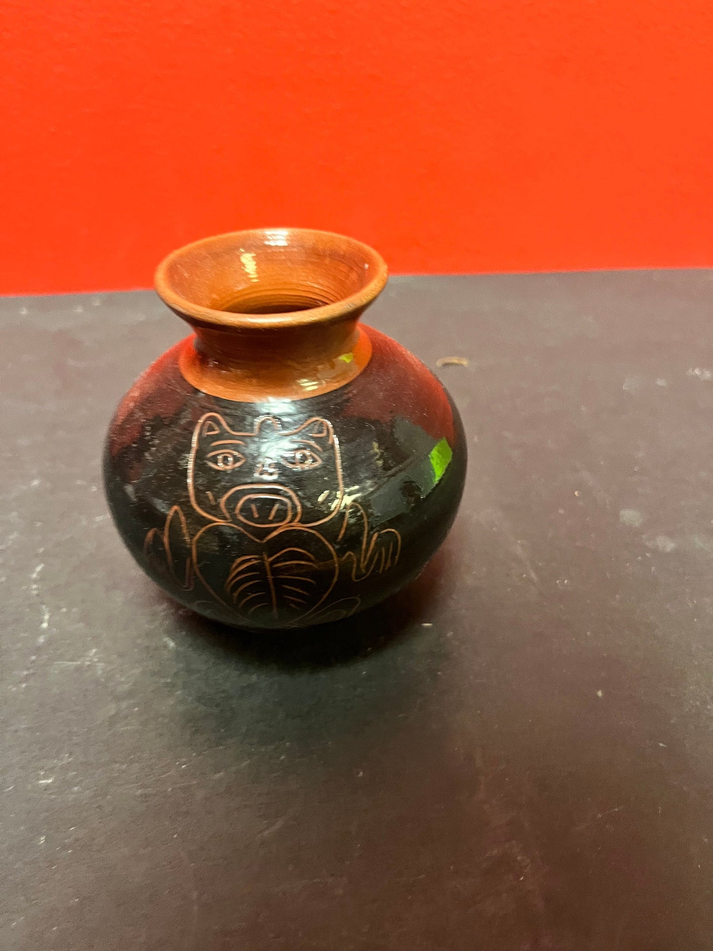 A  Lovely 4 inch high Canadian indigenous first nations  Haida pottery vase   signed  great imagery  perfect condition