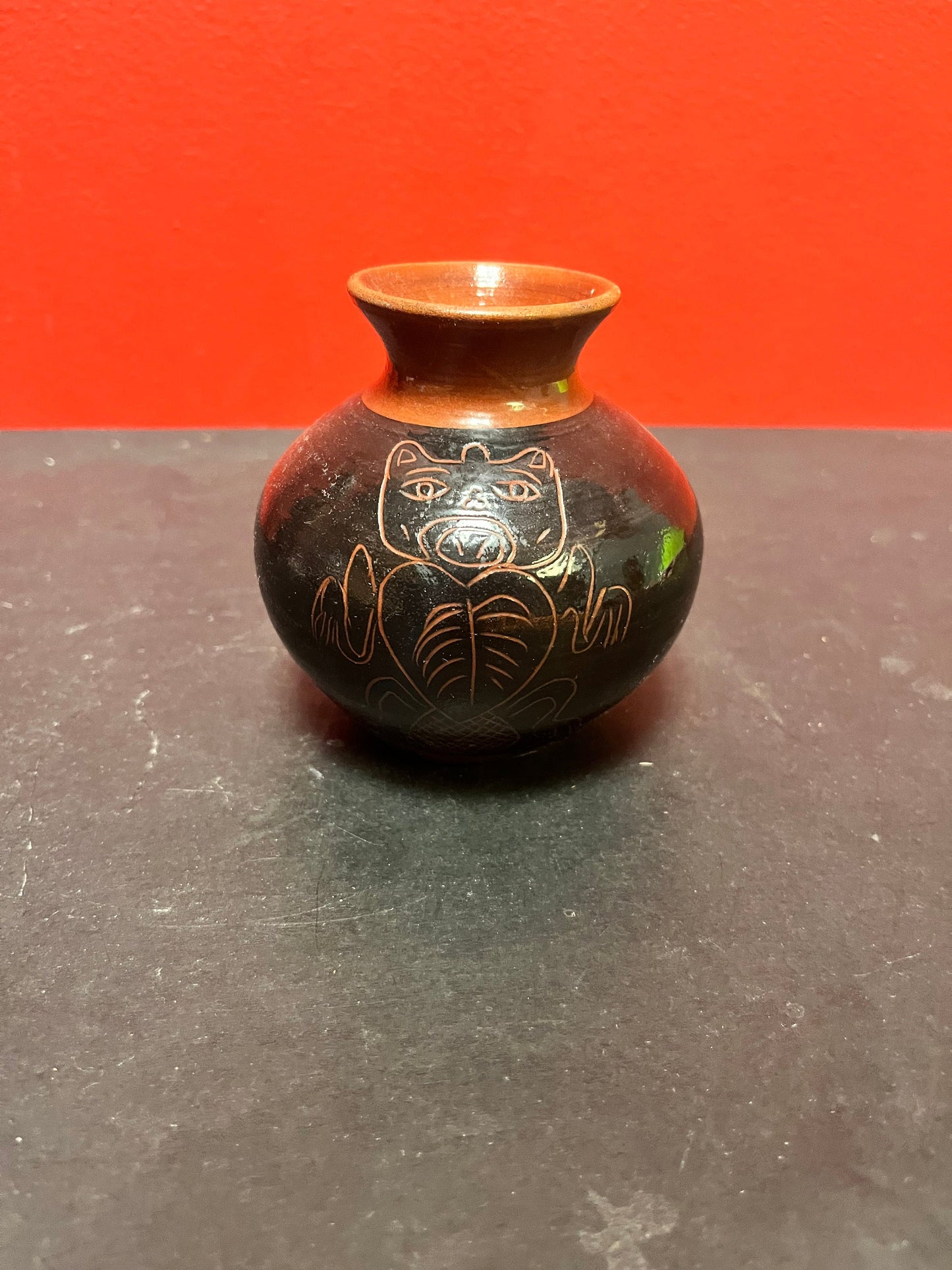 A  Lovely 4 inch high Canadian indigenous first nations  Haida pottery vase   signed  great imagery  perfect condition