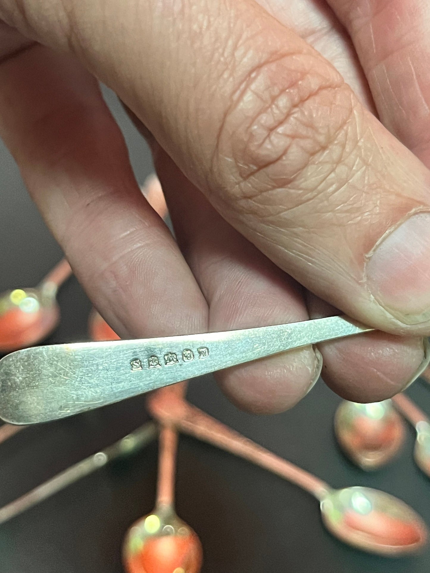 Set of 12 English sterling silver hallmarked teaspoons and sugar tongs  pretty design and needs a quick polish  great value
