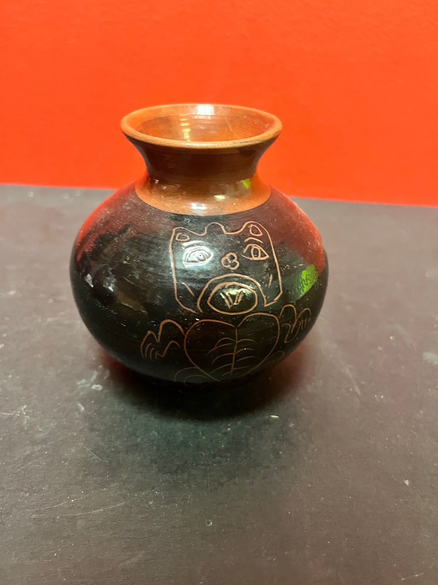 A  Lovely 4 inch high Canadian indigenous first nations  Haida pottery vase   signed  great imagery  perfect condition