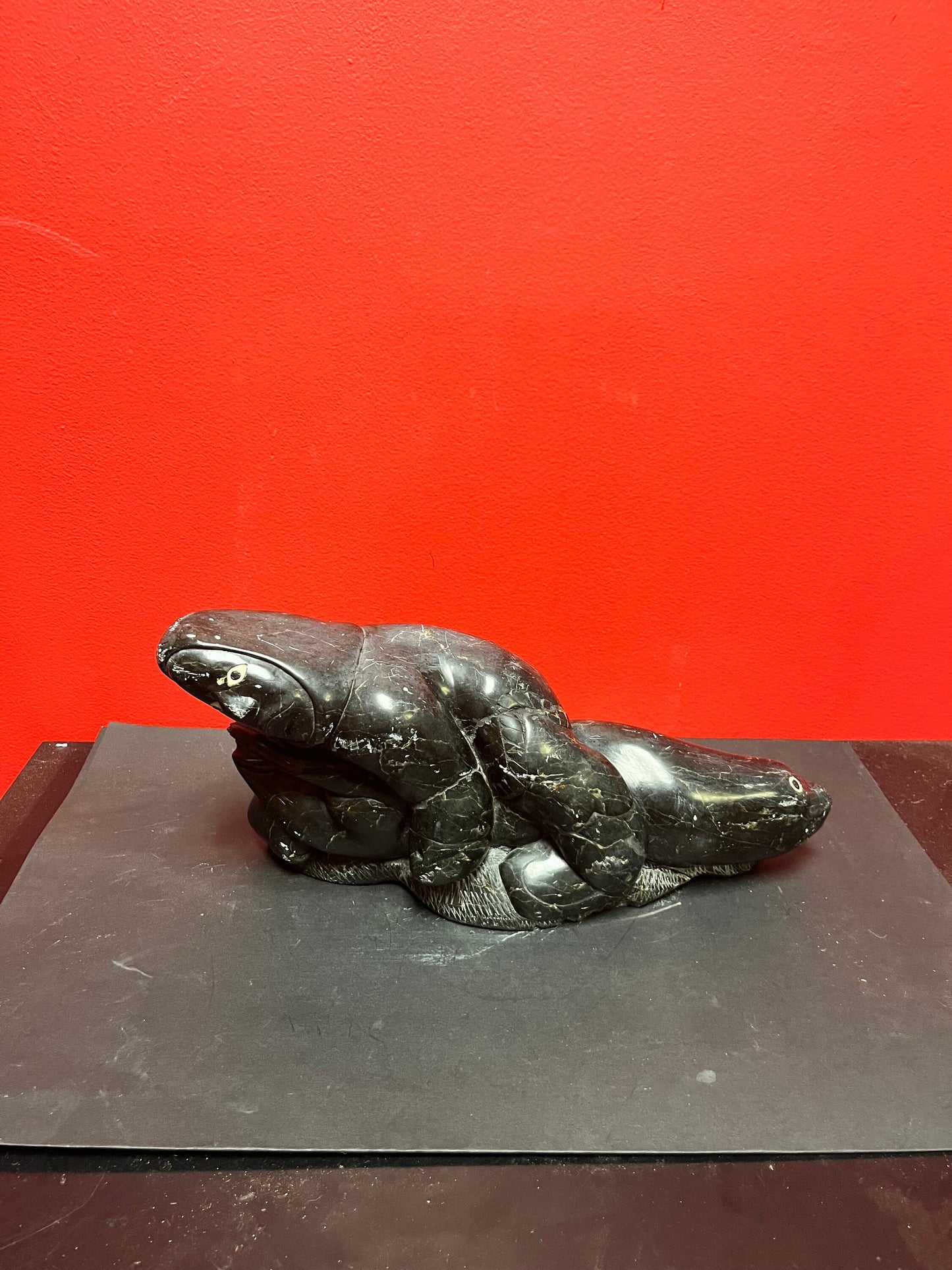 Fabulous signed authentic Canadian Eskimo soapstone Hunter versus seal   16 x 7 high with some minor scratches  approx 6 plus kilos