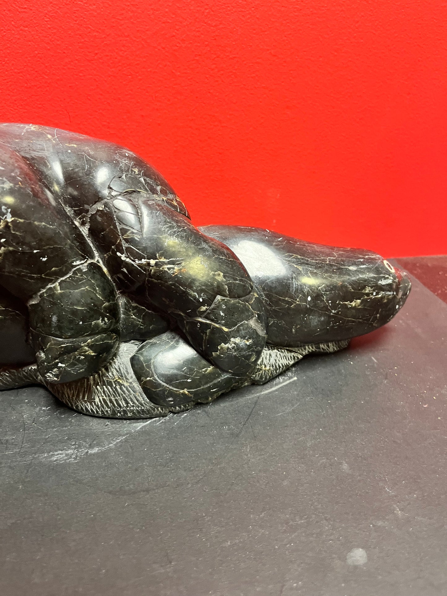 Fabulous signed authentic Canadian Eskimo soapstone Hunter versus seal   16 x 7 high with some minor scratches  approx 6 plus kilos