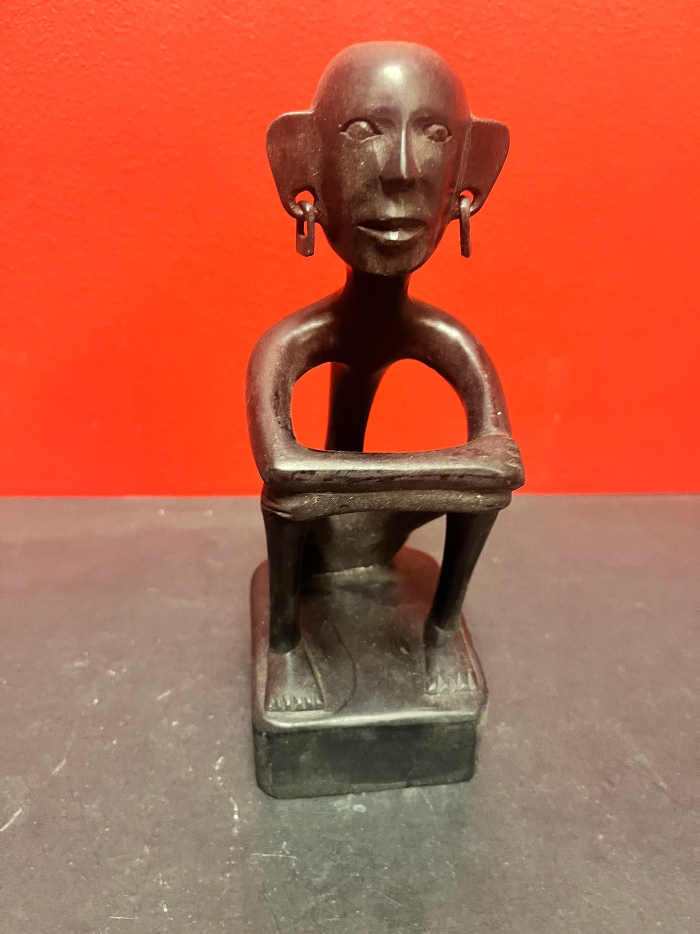 8 inch African statue of a thinking man  with earrings  unique and cool