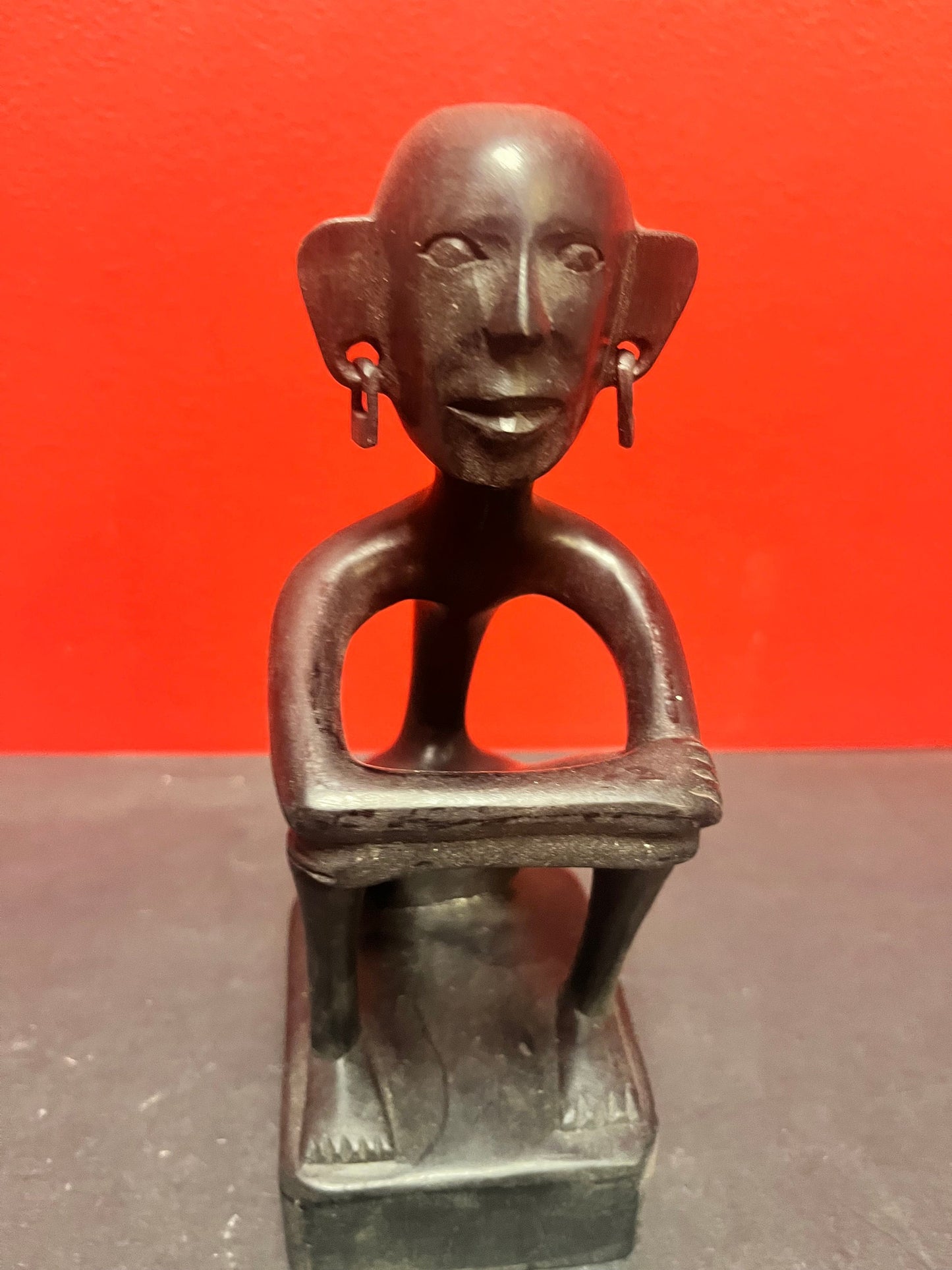 8 inch African statue of a thinking man  with earrings  unique and cool