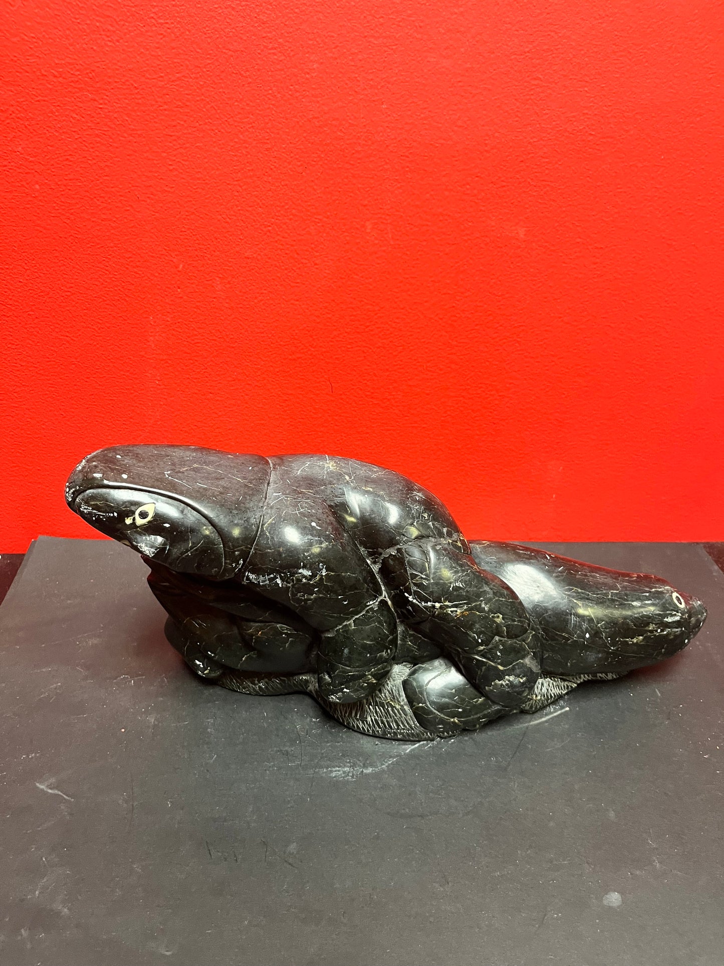 Fabulous signed authentic Canadian Eskimo soapstone Hunter versus seal   16 x 7 high with some minor scratches  approx 6 plus kilos
