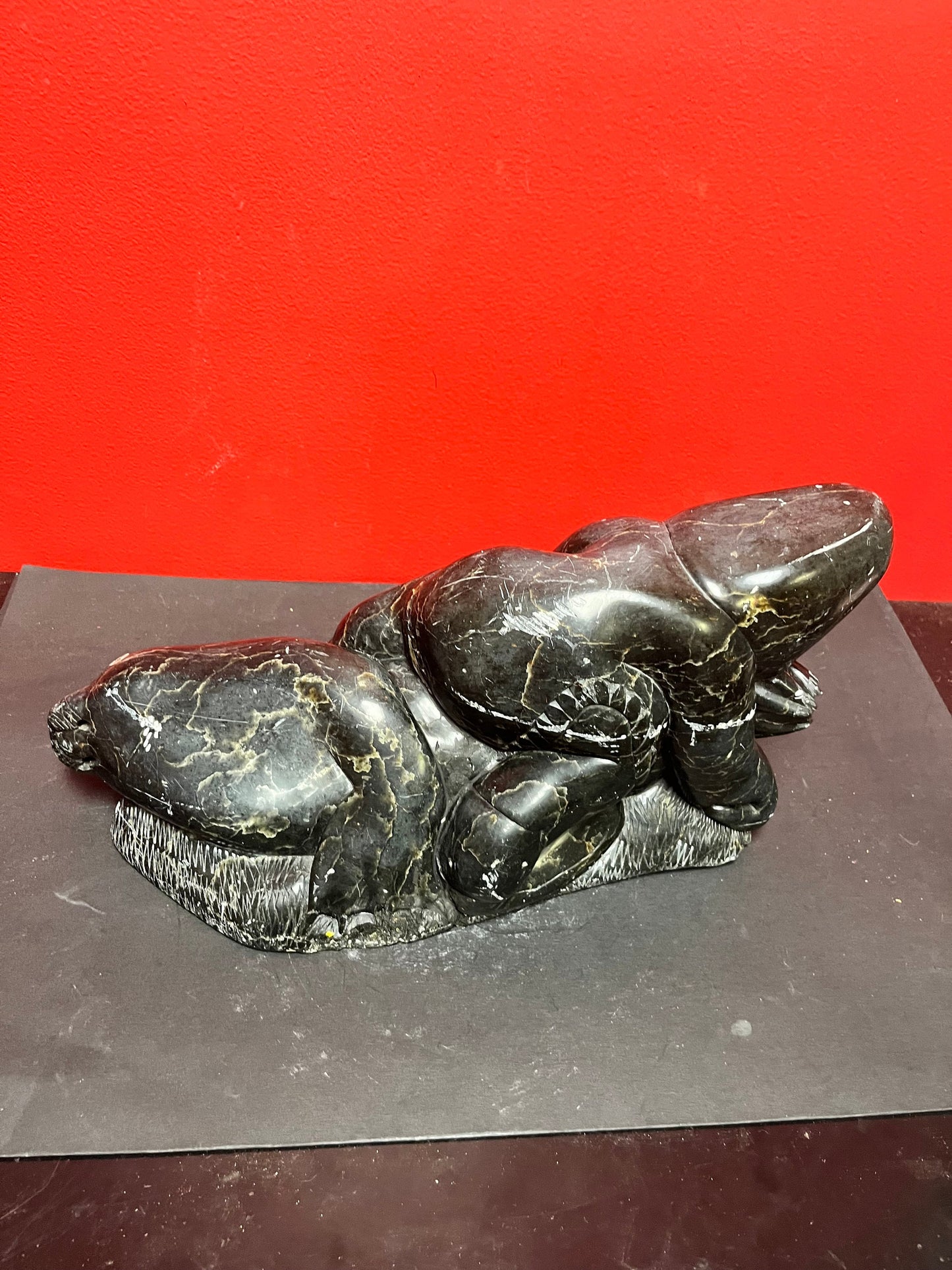 Fabulous signed authentic Canadian Eskimo soapstone Hunter versus seal   16 x 7 high with some minor scratches  approx 6 plus kilos