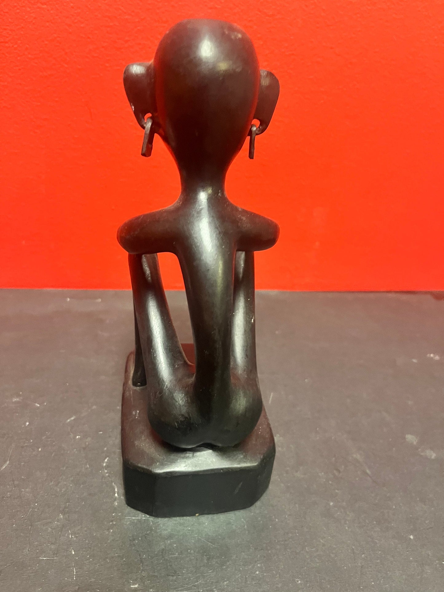 8 inch African statue of a thinking man  with earrings  unique and cool