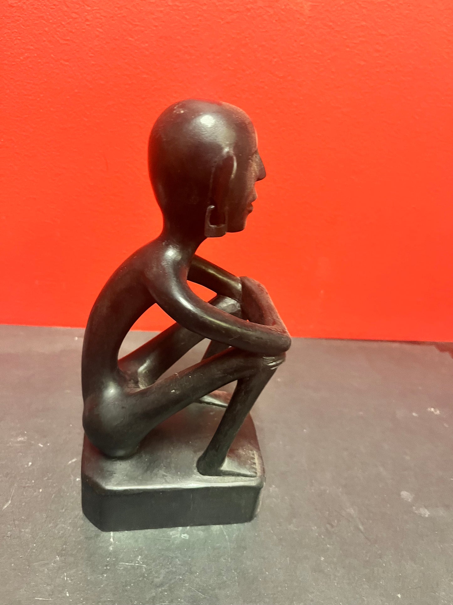 8 inch African statue of a thinking man  with earrings  unique and cool