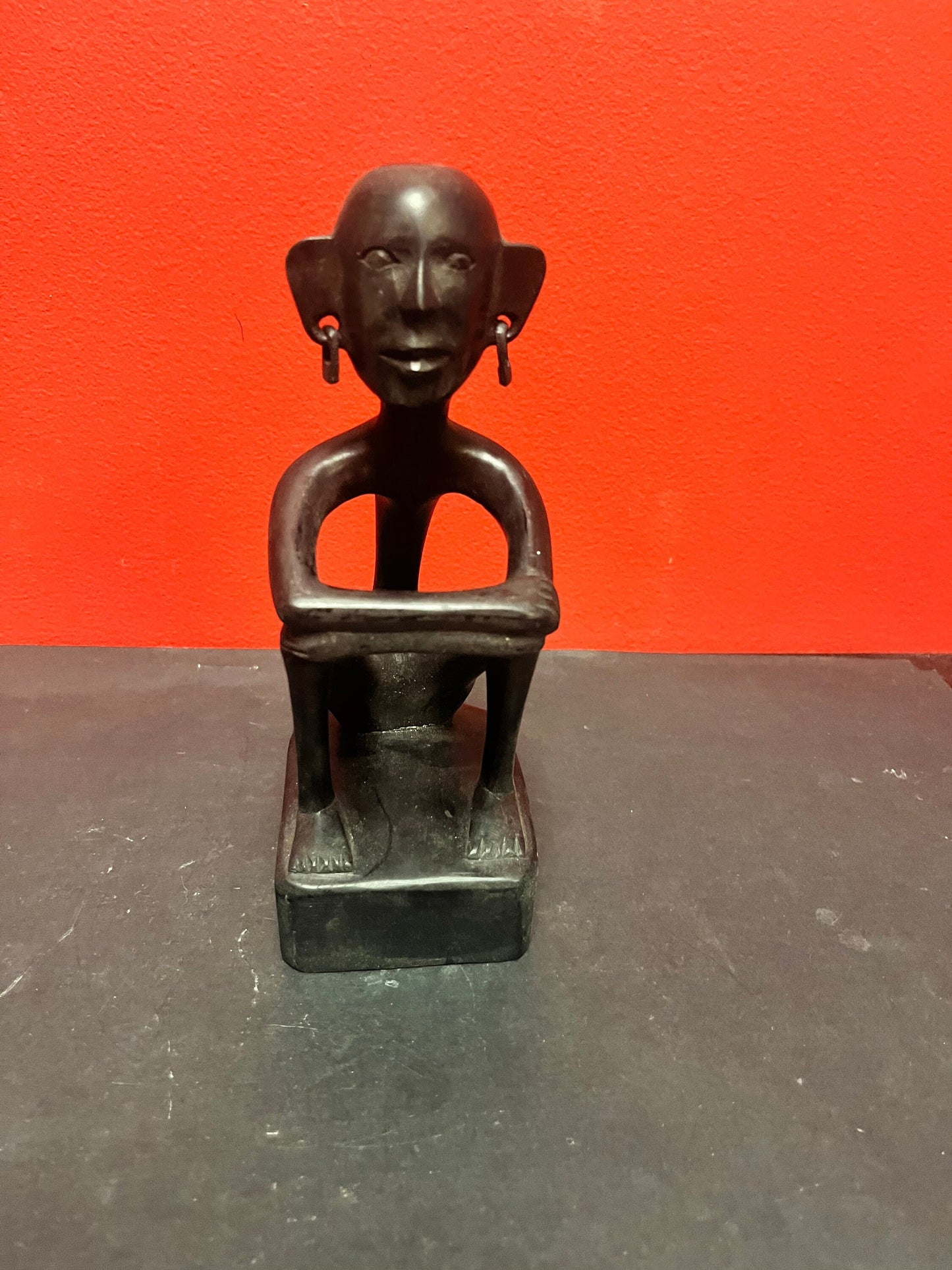 8 inch African statue of a thinking man  with earrings  unique and cool