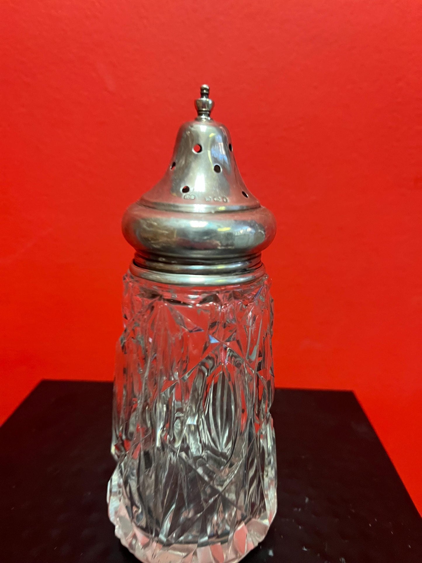 Lovely English sterling topped crystal sugar shaker   Good Hallmarks and sits 6 inches  inches high  Lovely piece