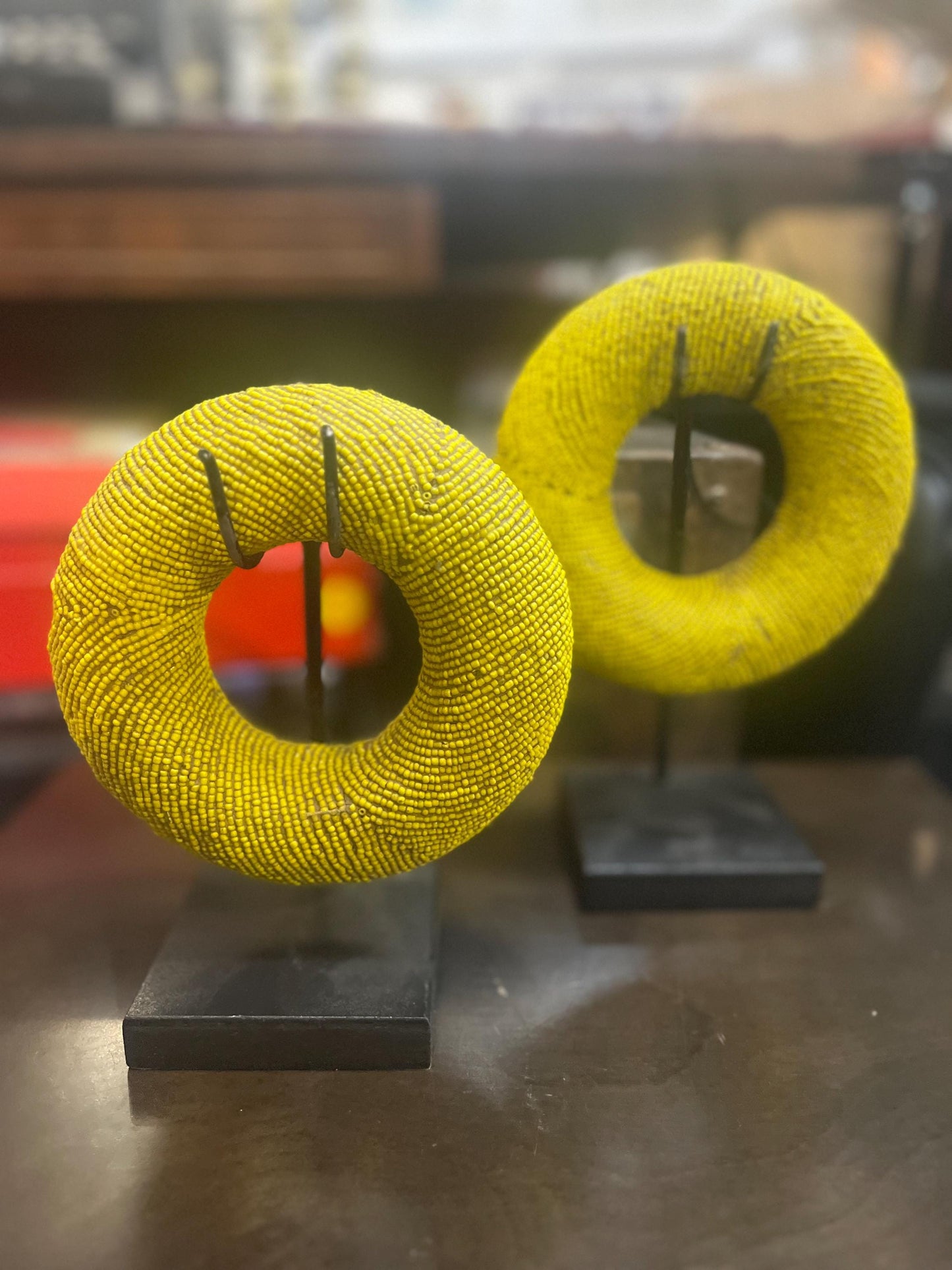 Pair of stunning museum quality antique Zulu wedding bronze and beaded ceremonial bracelets on stands heavy 5 and 6 inches wide