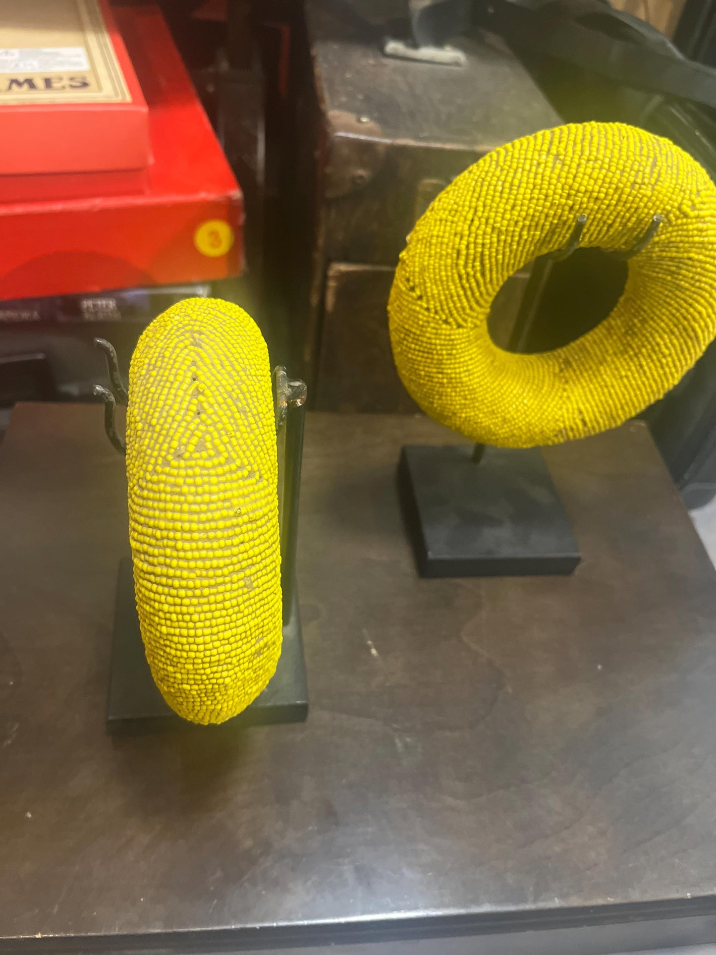 Pair of stunning museum quality antique Zulu wedding bronze and beaded ceremonial bracelets on stands heavy 5 and 6 inches wide