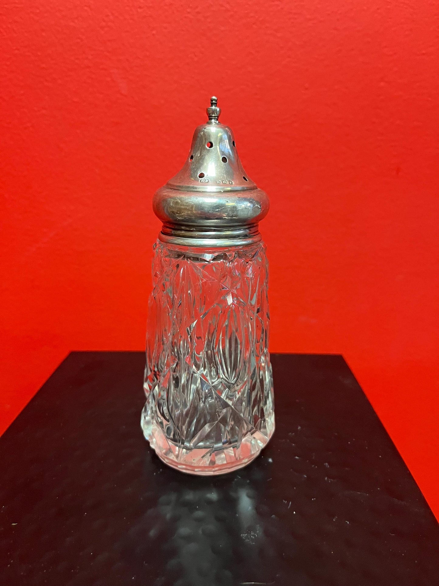 Lovely English sterling topped crystal sugar shaker   Good Hallmarks and sits 6 inches  inches high  Lovely piece