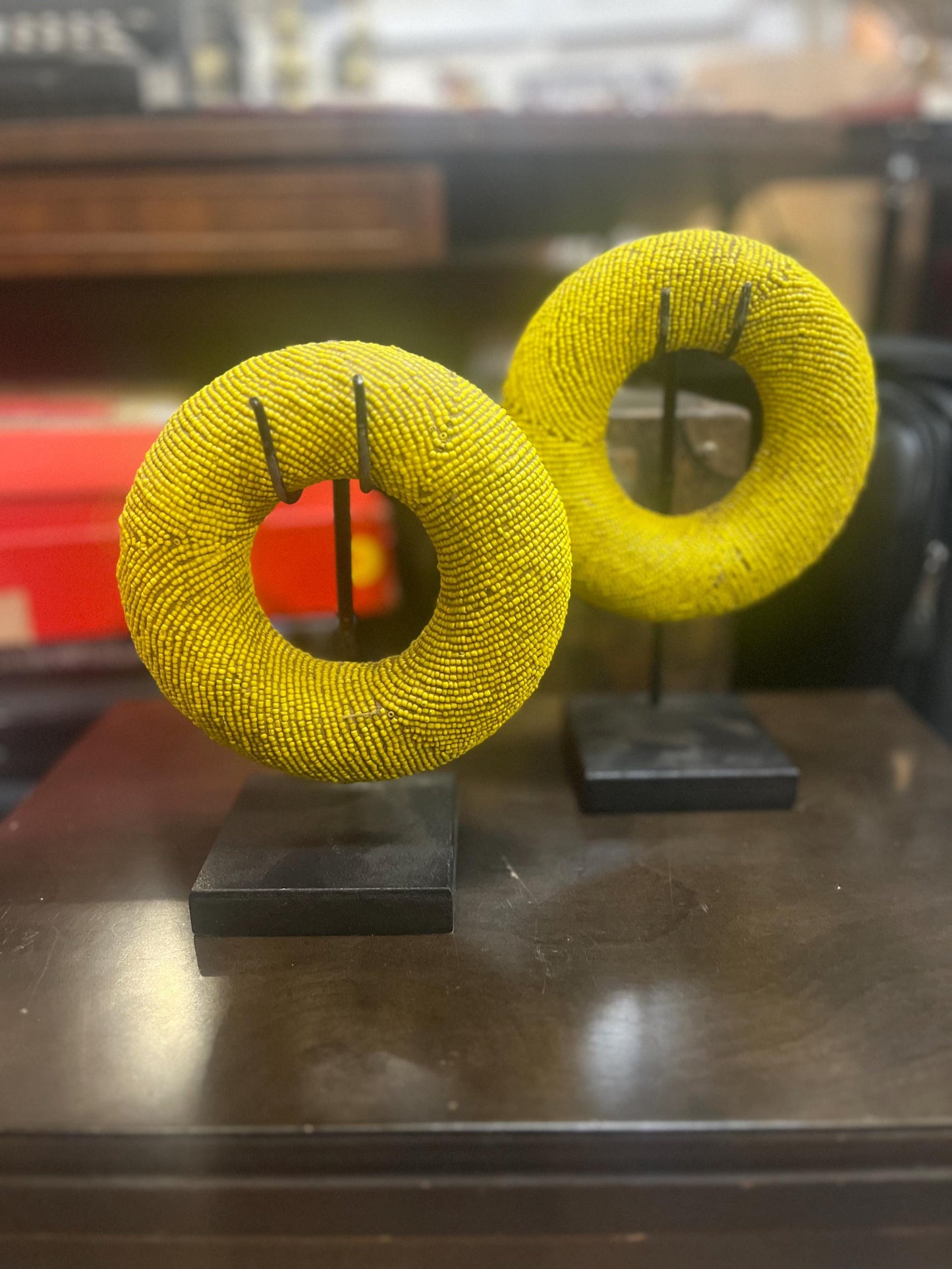 Pair of stunning museum quality antique Zulu wedding bronze and beaded ceremonial bracelets on stands heavy 5 and 6 inches wide