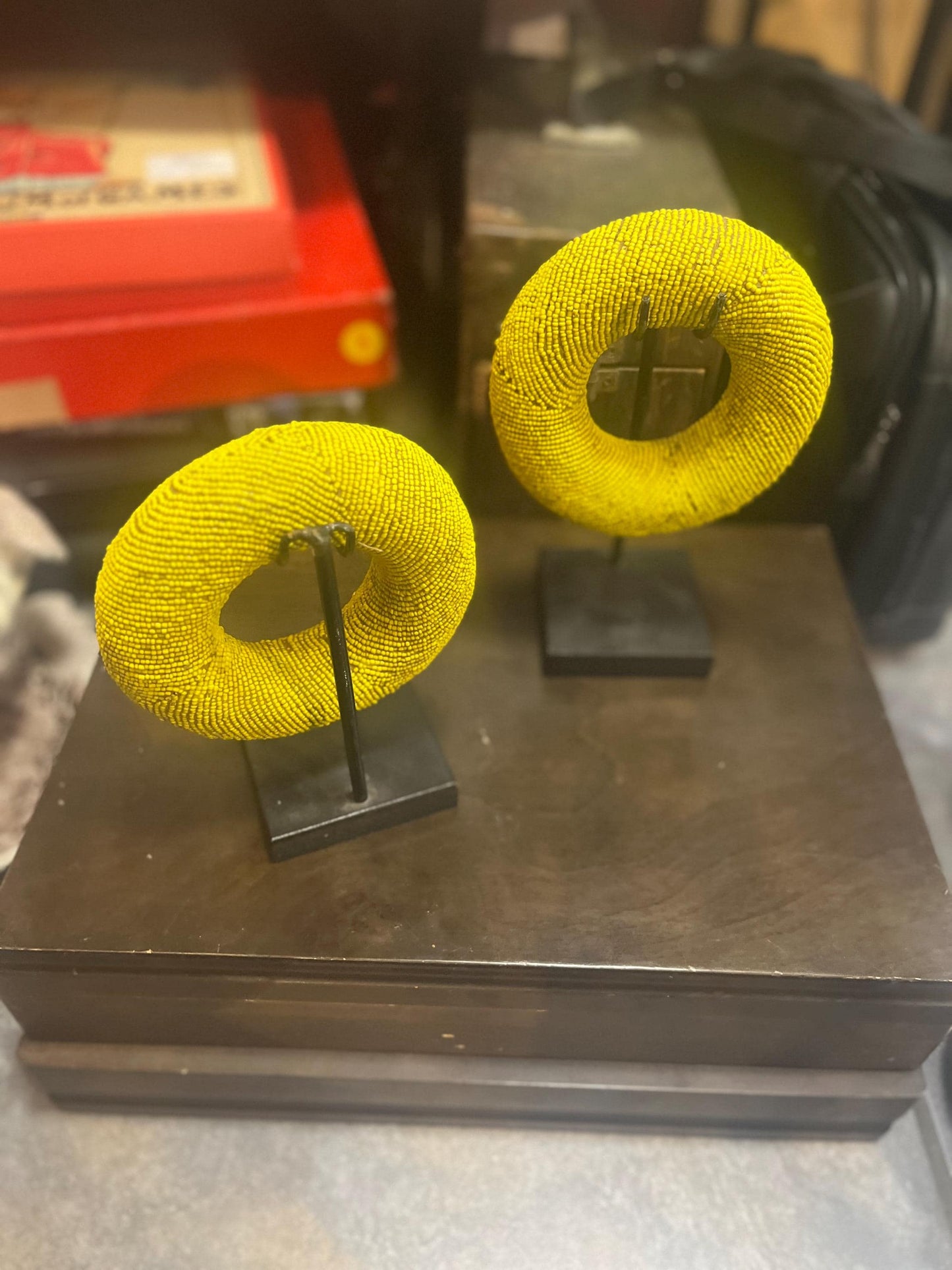 Pair of stunning museum quality antique Zulu wedding bronze and beaded ceremonial bracelets on stands heavy 5 and 6 inches wide